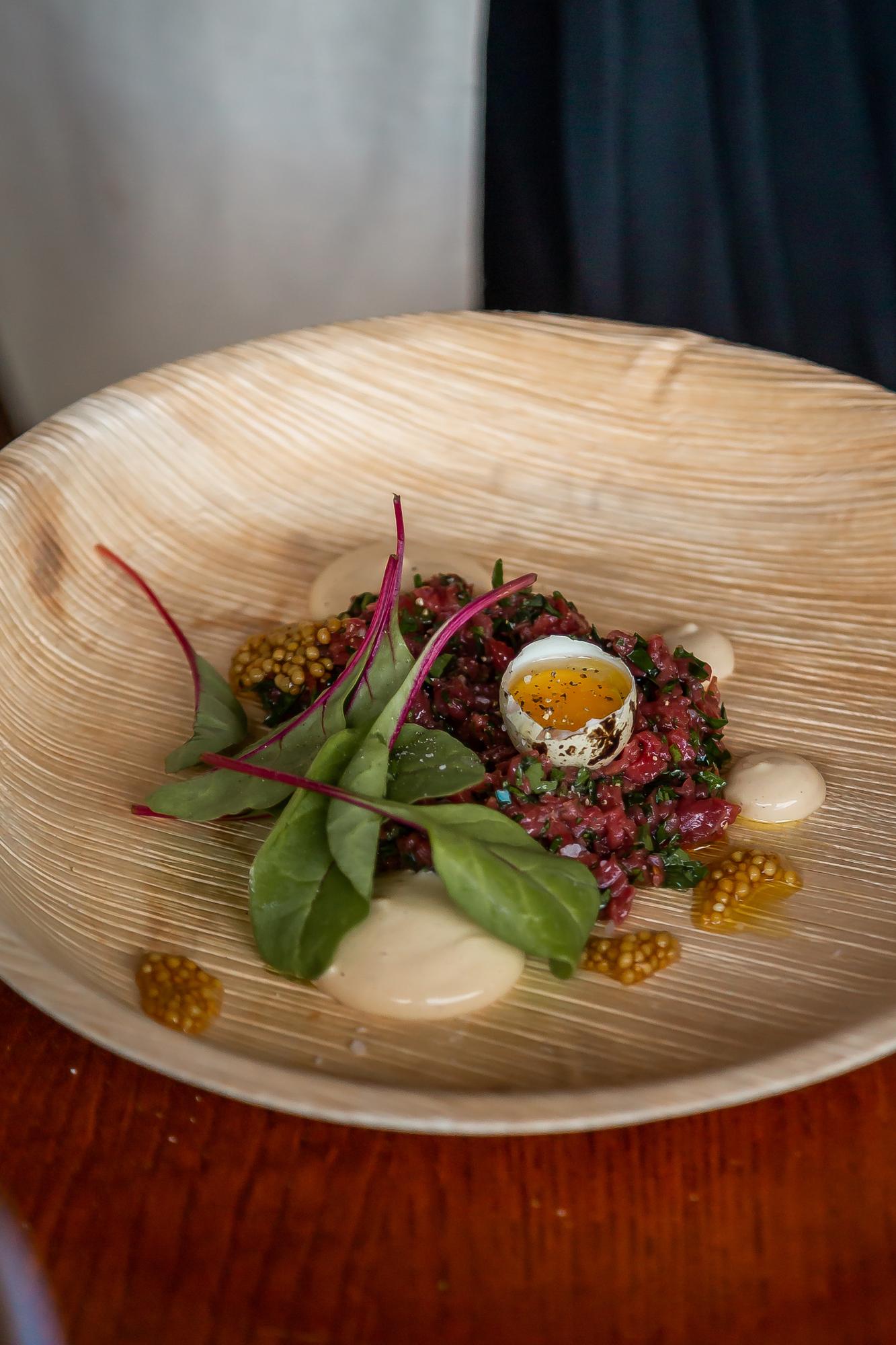 Plated seasonal starter on wooden table